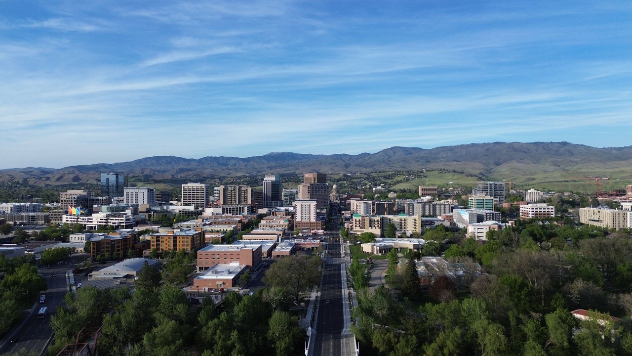 Stunning aerial capture of Boise, Idaho skyline with mountains in the background.