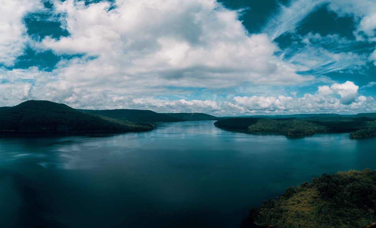 Breathtaking aerial view of Nickajack Lake under a serene blue sky in Jasper, Tennessee.