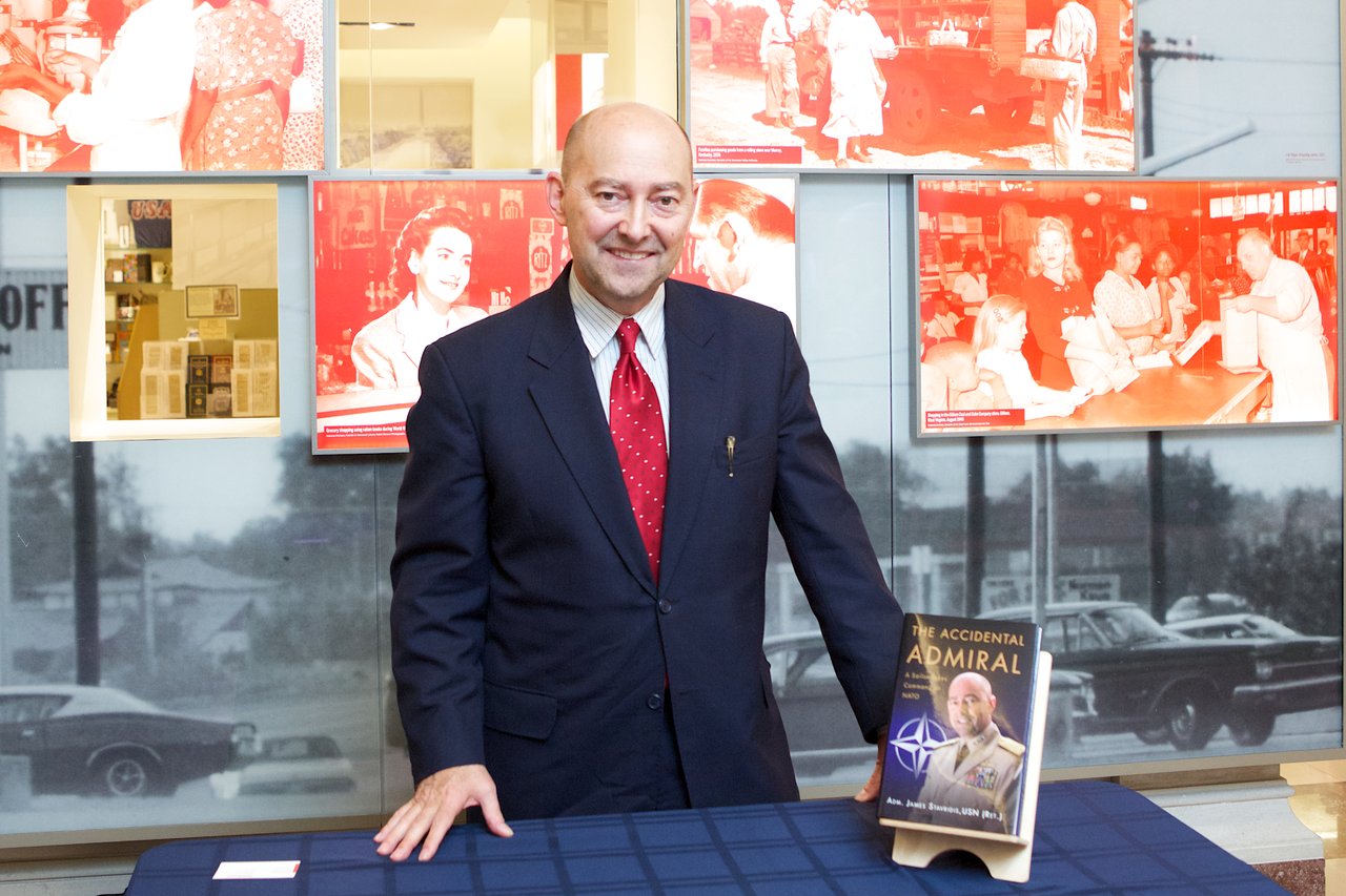 The Accidental Admiral; Admiral James G. Stavridis, author of The Accidental Admiral: A Sailor Takes Command of NATO, signs copies of his book following his lecture on the connection between reading a