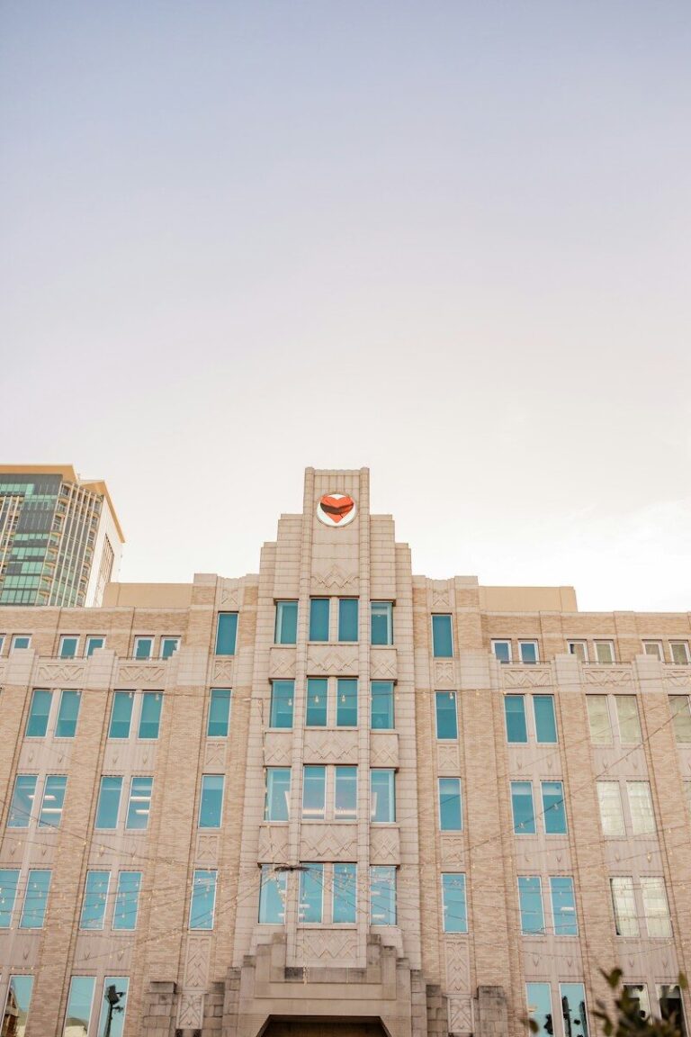 a large building with many windows and a clock on it